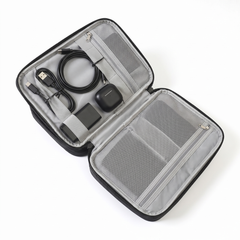 Stoiq Cable Organizer open, cables, earbuds and power bank in the elastic loops